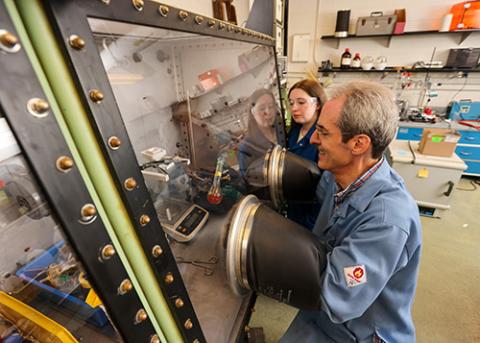 Professor and student work in a lab